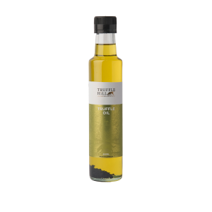 Golden glass bottle with a black label. Truffle Hill brand Truffle Oil.